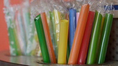 This July 17, 2018 photo shows wrapped plastic straws at a bubble tea cafe in San Francisco. Eco-conscious San Francisco joins the city of Seattle in banning plastic straws, along with tiny coffee stirrers and cup pluggers, as part of an effort to reduce plastic waste. It also makes single-use food and drink side items available upon request and phases out the use of fluorinated wrappers and to-go containers.