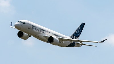 An Airbus A220 lands at Toulouse-Blagnac airport, southwestern France.