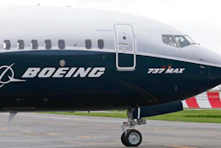 In this April 13, 2017, file photo, a pilot waves from the flight deck of a Boeing 737 MAX 9 as it rolls out for the airplane's first flight, in Renton, Wash. Boeing and the Brazilian jet maker Embraer will attempt to form a joint venture that would push the U.S. aerospace giant more aggressively into the regional aircraft market.