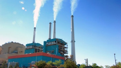 In this July 1, 2013, file photo, smoke rises from the Colstrip Steam Electric Station, a coal burning power plant in Colstrip, Mont. The Trump administration is advancing its plan to replace the centerpiece of President Barack Obama's efforts against global warming with a new rule expected to be more friendly to the coal industry.