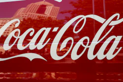 This file photo shows a Coca-Cola delivery van in downtown Pittsburgh. Coca-Cola is reporting strong profit and revenue numbers, thanks in part to rising demand for Diet Coke and Coca-Cola Zero Sugar in North America.