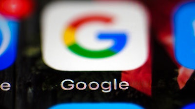 This Wednesday, April 26, 2017 file photo shows a Google icon on a mobile phone, in Philadelphia. European Union antitrust chief Margrethe Vestager is planning a statement on Wednesday, July 18, 2018 amid reports that her office will slap a record $5 billion fine on Google for abuse of its dominant position in the Android mobile phone operating systems. The decision was widely expected this week and financial media, including Bloomberg and the Financial Times, said the amount would total 4.3 billion euros.