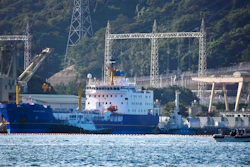 In this Sept. 21, 2017, file photo, the Pacific Egret cargo vessel, left, carrying MOX, a mixture of plutonium and uranium fuel, arrives at Takahama nuclear power plant in Takahama, western Japan. Japan’s nuclear policy-setting panel approved on Tuesday, July 31, 2018, a revised guideline on plutonium use, putting a cap on its stockpile and pledging to eventually reduce it to address international concern. Japan Atomic Energy Commission guideline adopted Tuesday calls for some government oversight to minimize plutonium separation and utilities to cooperate.