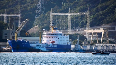 In this Sept. 21, 2017, file photo, the Pacific Egret cargo vessel, left, carrying MOX, a mixture of plutonium and uranium fuel, arrives at Takahama nuclear power plant in Takahama, western Japan. Japan’s nuclear policy-setting panel approved on Tuesday, July 31, 2018, a revised guideline on plutonium use, putting a cap on its stockpile and pledging to eventually reduce it to address international concern. Japan Atomic Energy Commission guideline adopted Tuesday calls for some government oversight to minimize plutonium separation and utilities to cooperate.