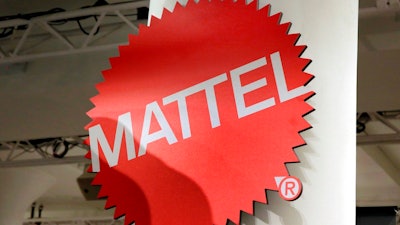 This April 26, 2018, file photo shows the Mattel logo at the TTPM 2018 Spring Showcase in New York. Mattel says it will cut 2,200 jobs as the maker of Barbie dolls and Hot Wheels cars tries to save money.