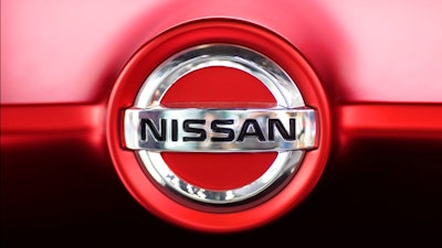 This June 14, 2018, file photo, shows a Nissan logo on a Nissan Concept 2020 Vision Gran Truismo on display at the automaker's showroom in Tokyo. Nissan Motor Co. says it has altered results of exhaust emissions and fuel economy tests of its new vehicles sold in Japan, in the latest misconduct to surface at the Japanese automaker.