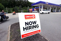 In this June 20, 2018, photo, a 'Now Hiring' sign is posted outside a gas station in Raymond, N.H. On Tuesday, July 10, the Labor Department reports on job openings and labor turnover for May.