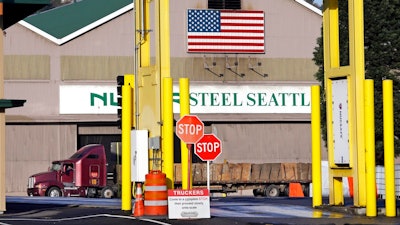 In this Feb. 25, 2016 file photo, a truck carries a load at the Nucor Steel plant in Seattle. U.S. companies pursuing exemptions from President Donald Trump’s tariff on imported steel are accusing American steel manufacturers of spreading inaccurate and misleading information, and they fear it may torpedo their requests. The president of one company calls objections raised by U.S. Steel and Nucor to his waiver request “literal untruths.”