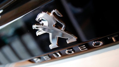 In this Feb. 23, 2017 file photo, the logo of French automaker Peugeot is pictured during the presentation of the company's 2016 full year results, in Paris. PSA Group, the maker of Peugeot and Citroen cars, is doing what General Motors failed to do in 20 years, make the mass market brands Opel Vauxhall profitable, revealing upbeat earnings Tuesday July 15, 2018, for the first six months of the year.