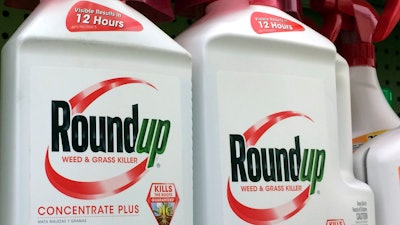 Containers of Roundup, a weed killer made by Monsanto, on a shelf at a hardware store in Los Angeles.
