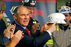 In this April 13, 2017, file photo, Environmental Protection Agency Administrator Scott Pruitt holds up a hardhat he was given during a visit to Consol Pennsylvania Coal Company's Harvey Mine in Sycamore, Pa. Pruitt moved to roll back environmental regulations affecting many industries. Pruitt proposed last year to repeal a key climate-change regulation of President Barack Obama’s administration, which aimed to reduce emissions of carbon-trapping gases from coal-fired power plants.