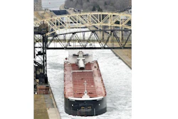 In this April 22, 2014 file photo, the carrier American Century moves out of the Soo Locks in Sault Ste. Marie, Mich., headed into Whitefish Bay, where an icebreaker escort awaits to lead the ship and others across the ice-clogged Lake Superior. Michigan officials say the federal government is taking a big step toward approving a long-sought project to boost cargo shipping on the Great Lakes. Gov. Rick Snyder and members of Congress say a U.S. Army Corps of Engineers report improves prospects for constructing a second navigation lock that can accommodate the largest vessels hauling iron ore and other cargo between Lake Superior and the other lakes.