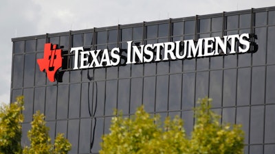 This Monday, Oct. 22, 2012, file photo shows corporate signage on the offices of Texas Instruments, in Richardson, Texas. On Tuesday, July 17, 2018, Texas Instruments dumped CEO Brian Crutcher for personal misconduct less than two months after he took over the job, ruining the chip maker's hopes for a smooth transition to new leadership.