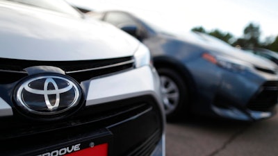 This Sunday, June 24, 2018 file photo shows the Toyota company logo on a car at a Toyota dealership in Englewood, Colo. Foreign automakers, American manufacturers and classic-car enthusiasts are coming out against President Donald Trump's plan to consider taxing imported cars, trucks and auto parts. Toyota Motor North America says the tariffs 'would have a negative impact on all manufacturers, increasing the cost of imported vehicles as well as domestically produced vehicles that rely on imported parts.' Friday, June 29, 2018 is the deadline for public comments on Trump's call for a Commerce investigation into whether auto imports pose enough of a threat to U.S. national security to justify tariffs.