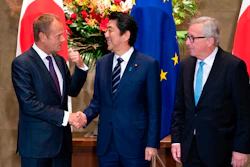 Japanese Prime Minister Shinzo Abe, center, shakes hands with European Council President Donald Tusk next to European Commission President Jean-Claude Juncker, right, before a meeting at Abe's official residence in Tokyo Tuesday, July 17, 2018. The European Union and Japan are signing a widespread trade deal Tuesday that will eliminate nearly all tariffs, seemingly defying the worries about trade tensions set off by U.S. President Donald Trump's policies.