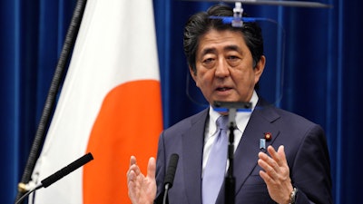 Japanese Prime Minister Shinzo Abe delivers a speech during a press conference at the prime minister's official residence in Tokyo Friday, July 20, 2018.
