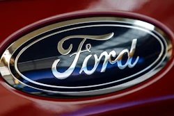 This Feb. 15, 2018, file photo shows a Ford logo on a vehicle at the Pittsburgh Auto Show in Pittsburgh. Ford is recalling about 550,000 cars and SUVs in North America to fix a gearshift problem that could cause the vehicles to roll away unexpectedly. The recall covers certain 2013 through 2016 Fusion sedans and some 2013 and 2014 Escape small SUVs. Owners will be notified by July 30.