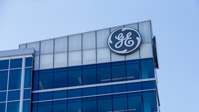 In this Jan. 16, 2018, photo, the General Electric logo is displayed at the top of their Global Operations Center in the Banks development of downtown Cincinnati. General Electric Co. reports earnings Friday, July 20.