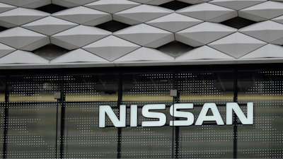 This June 14, 2018, file photo shows a Nissan logo at the automaker's showroom in Tokyo. Nissan is recalling nearly 105,000 small cars to replace Takata passenger air bag inflators that can explode and hurl shrapnel at drivers and passengers. Included are the 2011 Versa sedan and the 2011 and 2012 Versa hatchback.