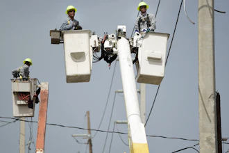 In this Oct. 19, 2017 file photo, a brigade from the Electric Power Authority repairs distribution lines damaged by Hurricane Maria in the Cantera community of San Juan, Puerto Rico. Jose Ortiz will take over Puerto Rico's Electric Power Authority on July 23, 2018, the company's second CEO in two weeks as it struggles with leadership issues, bankruptcy and the restoration of electricity to hundreds who have remained in the dark since Hurricane Maria.