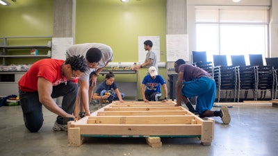 Students from the University of Kansas School of Engineering working on tiny homes that could provide temporary disaster relief.