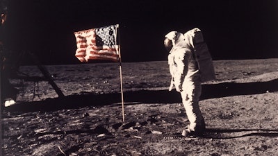 Edwin E. ‘Buzz’ Aldrin Jr. poses for a photograph beside the U.S. flag deployed on the moon during the Apollo 11 mission on July 20, 1969.