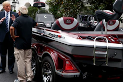 President Donald Trump talks with Jimmy Houston of Ranger Boats as he participates in a tour during a 'Made in America Product Showcase' at the White House, Monday, July 23, 2018, in Washington.