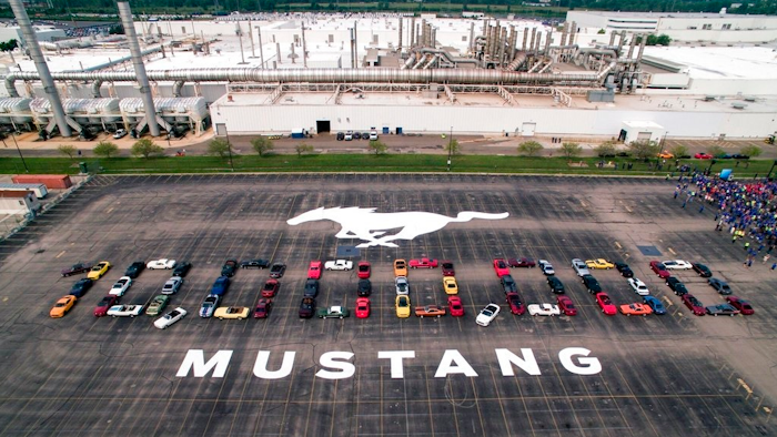 In this photo provided by the Ford Motor Co., Mustang vehicles are parked to spell out '10,000,000' on a parking lot at the Flat Rock Assembly plant, Wednesday, Aug. 8, in Flat Rock, Mich. The commas were represented by the first Mustang produced and the 10 millionth, a 2019 Wimbledon White GT V8 six-speed manual convertible.