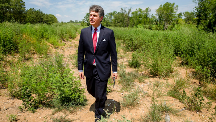 In this July 25, 2018, photo, Stephen Bell, president and CEO of the Arkadelphia Area Chamber of Commerce, shows parts of the 900-acre site of what he hopes will be a new paper mill, one of several Chinese-backed deals Arkansas has landed in recent years, in Arkadelphia, Ark. State and local officials in Arkansas are scrambling to preserve development deals with Chinese companies amid President Donald Trump's escalating tariff battle.