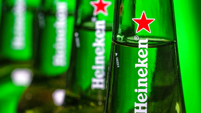 In this file photo dated Friday, March 30, 2018, bottles of Heineken beer are photographed in Washington, USA. Dutch brewing company Heineken said in a statement Friday Aug, 3, 2018, it is buying a 40 percent stake in the company that controls China’s biggest beer maker, China Resources Beer.