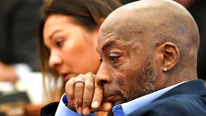 In this July 9, 2018, file photo, Plaintiff Dewayne Johnson, right, reacts while attorney Brent Wisner, not seen, speaks about his condition during the Monsanto trial in San Francisco. Monsanto is being accused of hiding the dangers of its popular Roundup products. A San Francisco jury on Friday, Aug. 10, 2018, ordered agribusiness giant Monsanto to pay $289 million to a former school groundskeeper dying of cancer, saying the company's popular Roundup weed killer contributed to his disease. The lawsuit brought by Johnson was the first to go to trial among hundreds filed in state and federal courts saying Roundup causes non-Hodgkin's lymphoma, which Monsanto denies.
