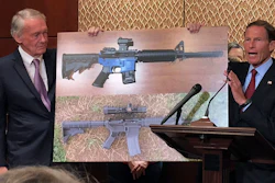 Sen. Edward Markey, D-Mass., left, and Sen. Richard Blumenthal, D-Ct., display a photo of a plastic gun on Tuesday, July 31, 2018, on Capitol Hill in Washington. Democrats are calling on President Donald Trump to reverse an administration decision to allow a Texas company to make blueprints for a 3D-printed gun available online.