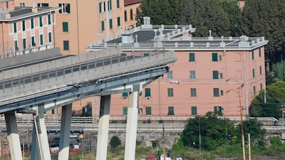 A view of the collapsed Morandi highway bridge, in Genoa, Italy, Sunday, Aug. 19, 2018. The unofficial death toll in Tuesday's collapse rose to 43 Saturday.