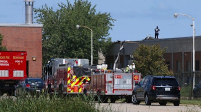 Fire crews are responding to a report of people trapped inside the Calumet Water Reclamation Plant after a fire and possible explosion caused part of the building's roof to collapse, on the Far South Side of Chicago, Thursday, Aug. 30, 2018.