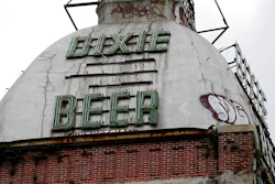 This Wednesday, July 3, 2013 file photo shows the top of the abandoned Dixie Beer brewery on Tulane Avenue in New Orleans. Nearly 13 years after Hurricane Katrina laid waste to the landmark brewery, plans have been announced for Dixie Beer to be brewed in New Orleans again.