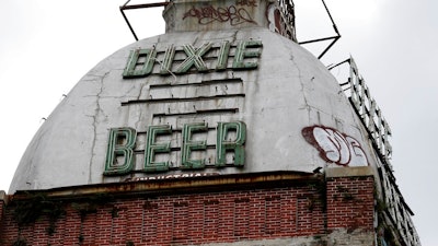 This Wednesday, July 3, 2013 file photo shows the top of the abandoned Dixie Beer brewery on Tulane Avenue in New Orleans. Nearly 13 years after Hurricane Katrina laid waste to the landmark brewery, plans have been announced for Dixie Beer to be brewed in New Orleans again.