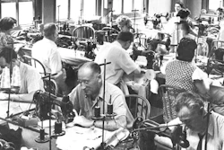 In this June 28, 1944, file photo, garment workers sew clothing at a loft factory in New York. Hundreds of thousands of garment workers once toiled in the sweaty, elbow-to-elbow workshops of midtown Manhattan before the whirring of sewing machines was mostly silenced by foreign competition. But a group of New Yorkers - manufacturers, landlords, designers, politicians - want to preserve some of the bustling sewing scene by zoning the neighborhood for at least 300,000 square feet of garment workshops now serving higher-end designers.