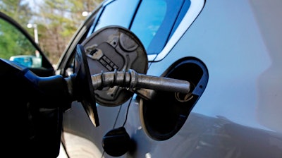 In this April 23, 2018, file photo a car is filled with gasoline at a station in Windham, N.H. Conserving oil is no longer an economic imperative for the U.S., the Trump administration declares in a major new policy statement that threatens to undermine decades of government campaigns for gas-thrifty cars and other conservation programs.