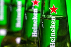 In this file photo dated Friday, March 30, 2018, bottles of Heineken beer are photographed in Washington, USA. Dutch brewing company Heineken said in a statement Friday Aug, 3, 2018, it is buying a 40 percent stake in the company that controls China’s biggest beer maker, China Resources Beer.