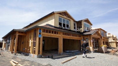 This May 4, 2018, file photo shows a house under construction in Roseville, Calif. On Thursday, Aug. 16, the Commerce Department reported on U.S. home construction in July.
