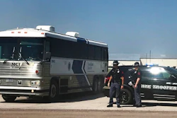 An ICE bus pulls out of a tomato plant in O'Neill, Neb., after an immigration raid at the plant Wednesday, Aug. 8, 2018. A large federal law enforcement operation conducted Wednesday targeted businesses in Nebraska and Minnesota that officials say knowingly hired - and mistreated - immigrants who are in the U.S. illegally.
