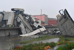 Rescuers work among the rubble of the collapsed Morandi highway bridge in Genoa, northern Italy, Tuesday, Aug. 14, 2018. A large section of the bridge collapsed over an industrial area in the Italian city of Genova during a sudden and violent storm, leaving vehicles crushed in rubble below.