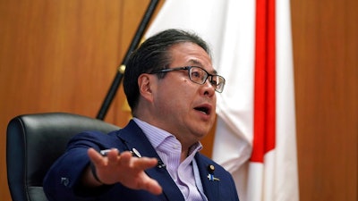 Japan’s Trade Minister Hiroshige Seko speaks during an exclusive interview with The Associated Press at his office in Tokyo Thursday, Aug. 23, 2018. Seko criticized President Donald Trump’s tariff policies as based on a serious misunderstanding about the importance of free trade and the contributions of Japanese companies to the U.S. economy.