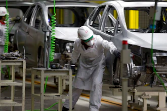 In this Feb. 21, 2014 file photo, employees at work in the new multibillion-dollar Honda car plant in Celaya, in the central Mexican state of Guanajuato. Many in the U.S. government, and even some in Mexico, say the new trade agreement reached in Aug. 2018, between the two countries will help increase the extremely low wages in Mexico's auto industry.