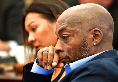 In this July 9, 2018, file photo, Plaintiff Dewayne Johnson, right, reacts while attorney Brent Wisner, not seen, speaks about his condition during the Monsanto trial in San Francisco. Monsanto is being accused of hiding the dangers of its popular Roundup products. A San Francisco jury on Friday, Aug. 10, 2018, ordered agribusiness giant Monsanto to pay $289 million to a former school groundskeeper dying of cancer, saying the company's popular Roundup weed killer contributed to his disease. The lawsuit brought by Johnson was the first to go to trial among hundreds filed in state and federal courts saying Roundup causes non-Hodgkin's lymphoma, which Monsanto denies.
