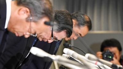 Suzuki Motor Corp. Representative Director and President Toshihiro Suzuki, second from left, bows with other official at the start of a press conference Thursday Aug. 9, 2018 in Tokyo. Suzuki Motor Corp., Mazda Motor Corp. and Yamaha Motor Co. have admitted using falsified emissions data to inspect their new vehicles in a product quality scandal in Japan's auto industry.
