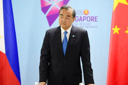 China's Foreign Minister Wang Yi pauses before a bilateral meeting with Philippines' Foreign Affairs Secretary Alan Cayetano on the sidelines of the 51st ASEAN Foreign Ministers Meeting in Singapore, Thursday, Aug. 2, 2018.