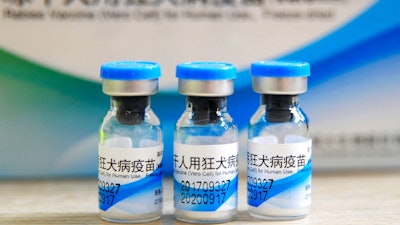 In this July 24, 2018, file photo, bottles of rabies vaccines made by Liaoning Chengda are seen at a Chinese Center for Disease Control and Prevention (CDC) station in Jiujiang in southern China's Jiangxi province. Two deputy Chinese provincial governors and a mayor were fired Thursday, Aug. 16, 2018 by the ruling Communist Party after revelations of misconduct by a major producer of anti-rabies vaccine triggered a public outcry.