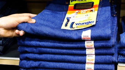 In this Feb. 4, 2011, File photo, Wrangler jeans are displayed at a store in Hayward, Calif. VF Corp. says it plans to split into two publicly traded companies, with one focusing on clothing and footwear and the other concentrating on jeans and its outlet businesses. VF Corp. previously sold the Nautica brand and purchased the Altra, Icebreaker and Williamson-Dickie brands. Some of its other brands include The North Face, Timberland and Wrangler.