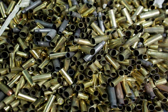 In this Jan. 5, 2016 file photo, empty bullet casings sit in a container at the National Armory gun store and gun range in Pompano Beach, Fla. A U.S. appeals court has upheld a California law that requires new models of semi-automatic handguns to stamp identifying information on bullet casings to help solve crimes. The 9th U.S. Circuit Court of Appeals in a 2-1 decision on Friday, Aug. 3, 2018 said the stamping requirement and two measures intended to make guns safer did not violate the 2nd Amendment.